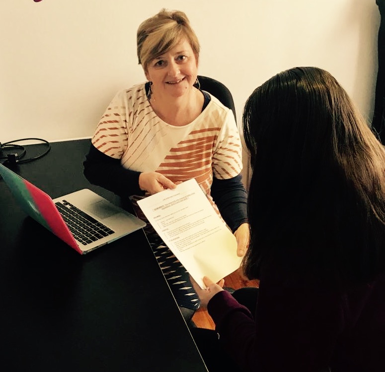 Denise helping a client search for training courses Denise helping a client search for training courses